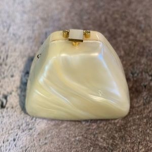 Vintage, ivory, pearlescent, acrylic clutch contemporary triangular silhouette.